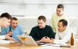© JackF - Men drink beer and try to help friend solve problems using laptop and the Internet
