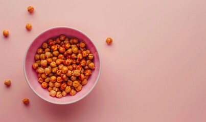 Roasted chickpeas with paprika in a pastel pink bowl