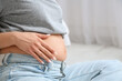 © Pixel-Shot - Young pregnant woman in bedroom, closeup