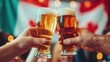 © Naret - People sharing a toast with Canadian beer, Canada Day, festive cheer