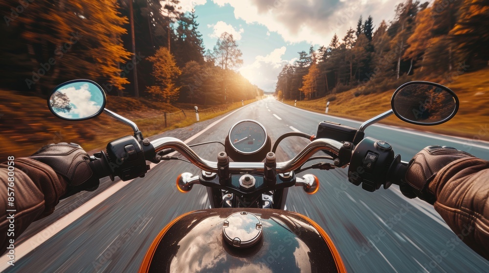 First-person view of a motorcyclist riding along an asphalt road ...