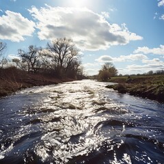 Canvas Print - A river with a cloudy sky in the background