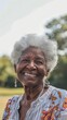 © Sasa Visual - Close-up portrait of an elderly woman smiling outdoors