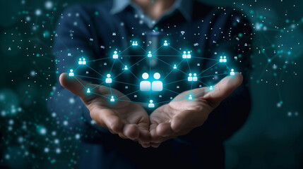 Businessman holding virtual Human Resources network connection icons. Employee Engagement, Talent Management, Workforce Connectivity. Internet business and social network.