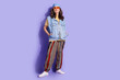 © deagreez - Full length photo of lovely pensioner lady posing fashion model dressed stylish denim hipster garment isolated on purple color background