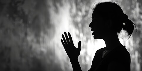 Wall Mural - Empowering silhouette of a woman speaking out against domestic violence.