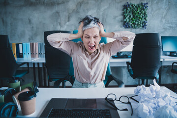 Poster - Photo of irritated annoyed age lady agent dressed formal shirt working modern gadget indoors workplace workstation loft