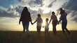 © maxximmm - Silhouette of a big family walking at sunset. People child summer concept. Big family walking in nature in the park. Silhouette of a family walking in lifestyle nature in the park at sunset.