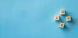 © Yana - Horizontal image of wooden cubes with text 'love' on isolated light blue background, copy space for text. For banner, design, presentation, slide, social media, profile, LinkedIn, cover, thumbnail