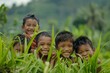 © Iigo - Group of happy kids smiling at camera in green rice field, Ubud, Bali, Indonesia