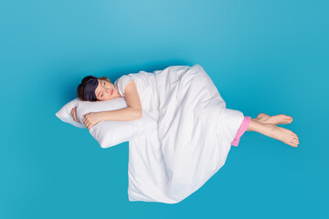 Sticker - Photo of lovely cute girl wear white stylish pajama enjoy peaceful dream isolated on blue color background