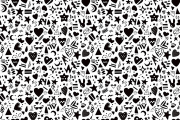 Wall Mural - A bold seamless pattern with black doodles of hearts, stars, and other playful shapes on a white background, creating a fun and dynamic tile ornament perfect for modern and quirky designs