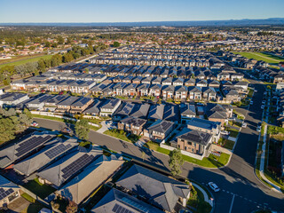 Wall Mural - Aerial drone view of The Ponds in the North West of Sydney, NSW Australia on a sunny morning in June 2024 showing the densely packed homes and housing density 