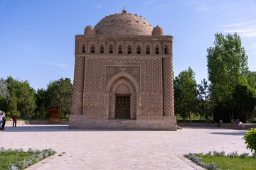 Wall Mural - A large building with a dome on top. The building is surrounded by trees and has a courtyard