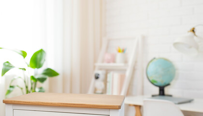 Wall Mural - top part of wooden cabinet table with space in blur educational room