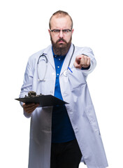 Sticker - Young doctor man holding clipboard over isolated background pointing with finger to the camera and to you, hand sign, positive and confident gesture from the front