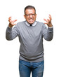 © Krakenimages.com - Middle age bussines arab man wearing glasses over isolated background Shouting frustrated with rage, hands trying to strangle, yelling mad