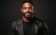 © imagineRbc - A man with a beard and a black leather jacket is smiling