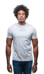 Poster - Afro american man over isolated background with serious expression on face. Simple and natural looking at the camera.