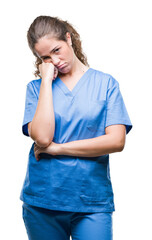 Sticker - Young brunette doctor girl wearing nurse or surgeon uniform over isolated background thinking looking tired and bored with depression problems with crossed arms.