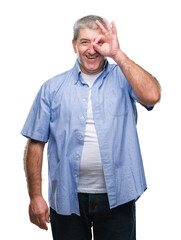 Sticker - Handsome senior man over isolated background doing ok gesture with hand smiling, eye looking through fingers with happy face.