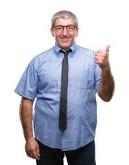 Poster - Handsome senior business man over isolated background smiling with happy face looking and pointing to the side with thumb up.