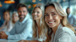 © Sudarshana - wide closeup portrait photo of a businesswoman and her team in an office meeting, looking at a presentation and smile to the camera