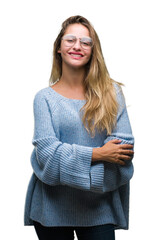 Sticker - Young beautiful blonde woman wearing sweater and glasses over isolated background happy face smiling with crossed arms looking at the camera. Positive person.