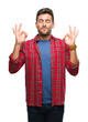 © Krakenimages.com - Young handsome man over isolated background relax and smiling with eyes closed doing meditation gesture with fingers. Yoga concept.