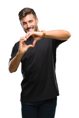 Sticker - Young handsome man over isolated background smiling in love showing heart symbol and shape with hands. Romantic concept.