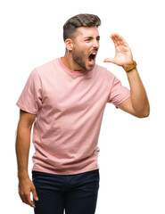 Sticker - Young handsome man over isolated background shouting and screaming loud to side with hand on mouth. Communication concept.