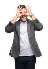 Sticker - Young handsome business man over isolated background doing ok gesture like binoculars sticking tongue out, eyes looking through fingers. Crazy expression.