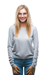 Canvas Print - Young beautiful blonde woman wearing glasses over isolated background with a happy and cool smile on face. Lucky person.