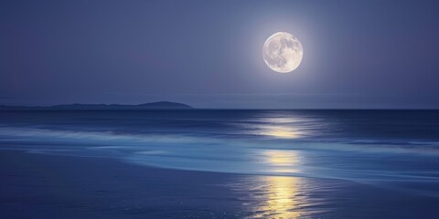 full moon rising over the ocean.