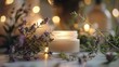 © Prostock-studio - A close-up shot of a lit candle with a soft glow, surrounded by lavender sprigs. The background is blurred with bokeh lights, creating a warm and inviting atmosphere.