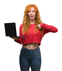 Sticker - Young redhead woman using computer laptop with surprise face pointing finger to himself