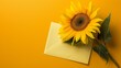 © muhriZ - Sunflower adorned envelope on yellow background with ample copy space