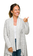 © Krakenimages.com - Beautiful middle age adult woman wearing winter sweater over isolated background smiling with happy face looking and pointing to the side with thumb up.
