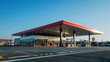 © Nany - A modern petrol station with multiple fuel pumps and a convenience store, set against a clear blue sky or neutral background, leaving ample space for text or branding