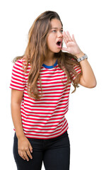 Poster - Young beautiful brunette woman wearing stripes t-shirt over isolated background shouting and screaming loud to side with hand on mouth. Communication concept.