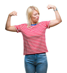 Sticker - Young beautiful blonde woman over isolated background showing arms muscles smiling proud. Fitness concept.