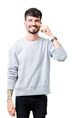 Poster - Young handsome man wearing sweatshirt over isolated background Pointing with hand finger to face and nose, smiling cheerful