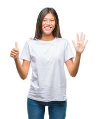 Sticker - Young asian woman over isolated background showing and pointing up with fingers number six while smiling confident and happy.