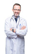 © Krakenimages.com - Middle age senior hoary doctor man wearing medical uniform isolated background happy face smiling with crossed arms looking at the camera. Positive person.