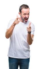 Sticker - Middle age hoary senior man wearing white t-shirt over isolated background pointing fingers to camera with happy and funny face. Good energy and vibes.