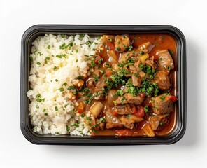 Wall Mural - Delicious Beef Stew with Rice in a Black Container