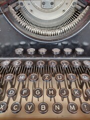 Close up of keys of dusty vintage typwriter. For sale at second hand shop. Mechanical Machine for typing characters. Typenhebelschreibmaschine in German.