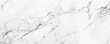 © AI_images - Minimalist white marble background with subtle grey veining and a smooth, polished texture. The clean, elegant look adds sophistication and simplicity, ideal for modern or high-end designs