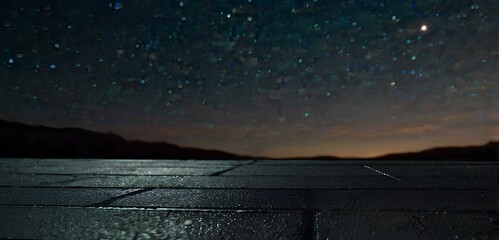 Empty asphalt floor with night sky .