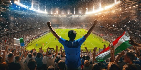 A fan at a soccer match joyfully celebrates a thrilling event, raising his arms in excitement. The Cup match provides entertainment and fun for leisure seekers. AIG41